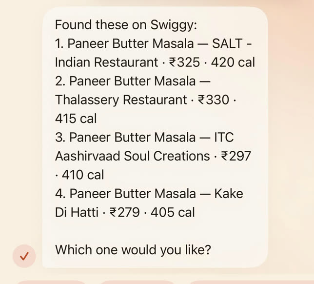 Ask reply listing four paneer butter masala options on Swiggy with restaurant, price and calories, and asking which one you would like.